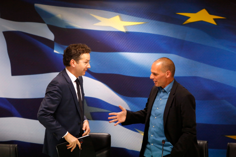 Finansminister Varoufakis och representant för Trojkan.